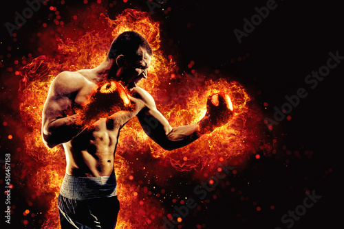 Fighter man in fire. Sport advertising. MMA boxer