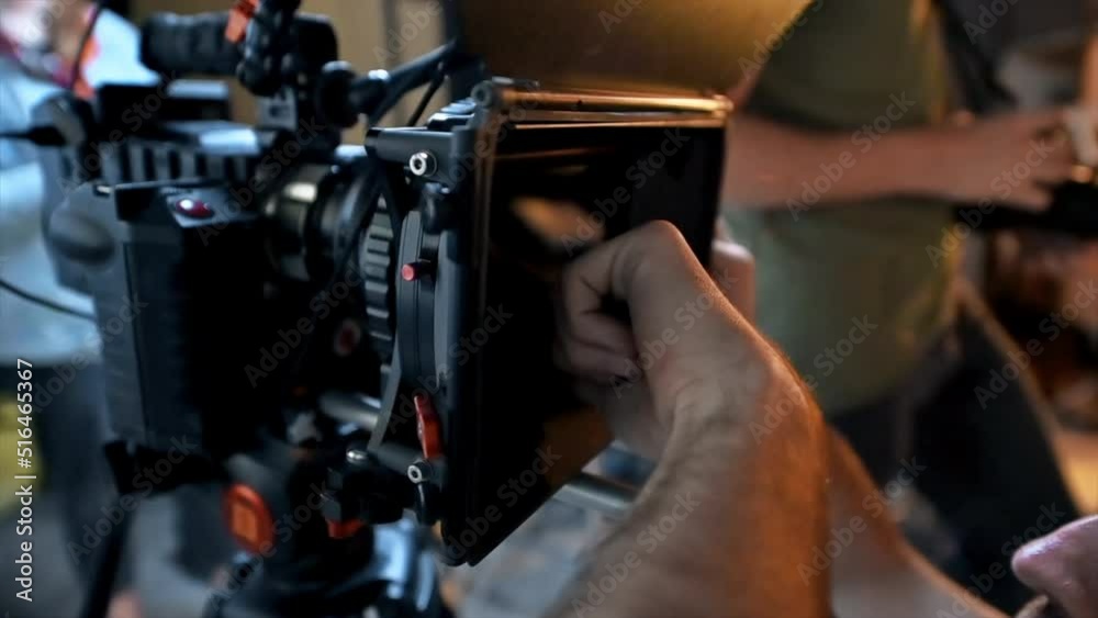 The cameraman working with a professional camera on the set in a studio The cameraman working with a professional camera on the set in a studio