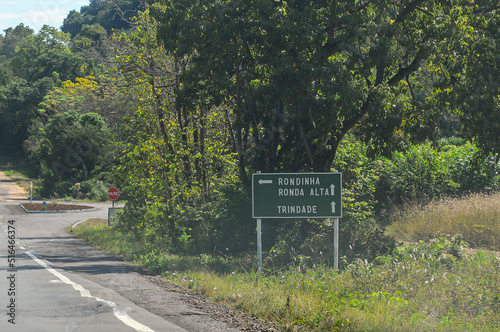 Road sign showing directions to cities in the state of Rio Grande do Sul, on Road RS-404. Rondinha, Ronda Alta, Trindade do Sul