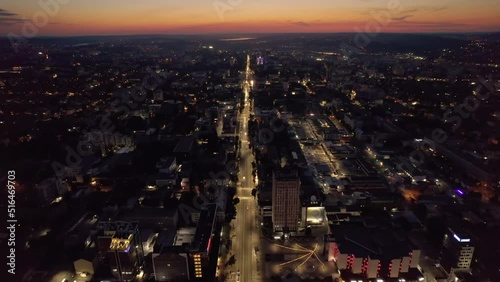 Aerial drone view of Chisinau downtown at sunset. Roads with moving cars and illumination. Moldova photo