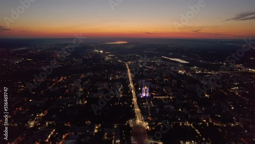 Aerial drone view of Chisinau downtown at sunset. Roads with moving cars and illumination. Moldova photo