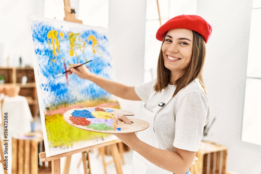 Young hispanic artist woman wearing french beret drawing at art studio. Young hispanic artist woman wearing french beret drawing at art studio.