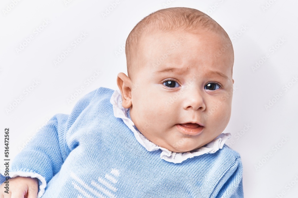 Adorable baby relaxed over white isolated background