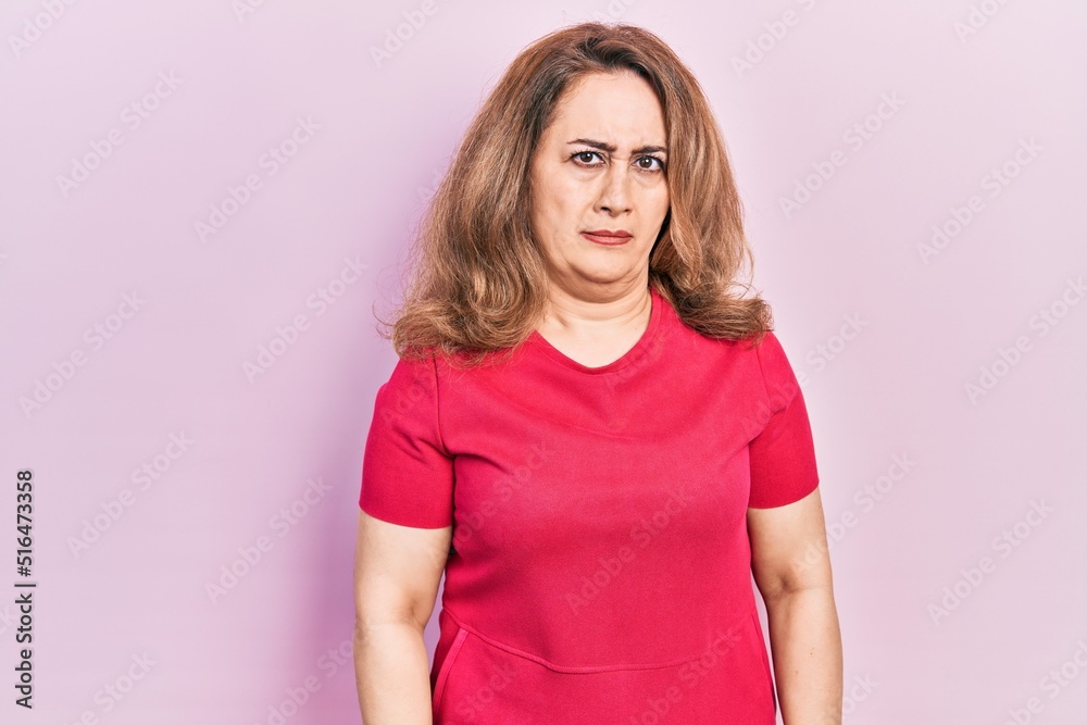 Middle age caucasian woman wearing casual clothes skeptic and nervous, frowning upset because of problem. negative person. Middle age caucasian woman wearing casual clothes skeptic and nervous, frowning upset because of problem. negative person.