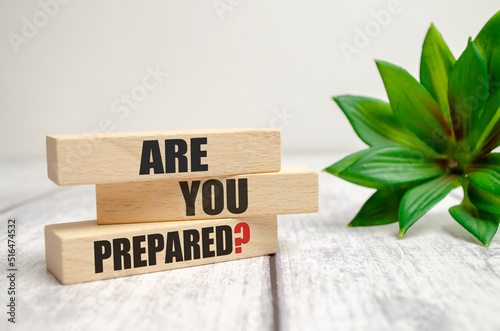 On a light background, wooden cubes and a wooden block with the text Are You Prepared Question