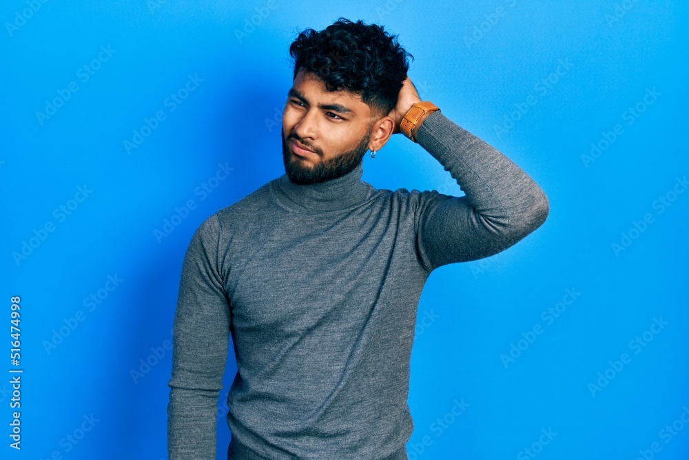 Arab man with beard wearing turtleneck sweater confuse and wondering about question. uncertain with doubt, thinking with hand on head. pensive concept. Arab man with beard wearing turtleneck sweater confuse and wondering about question. uncertain with doubt, thinking with hand on head. pensive concept.
