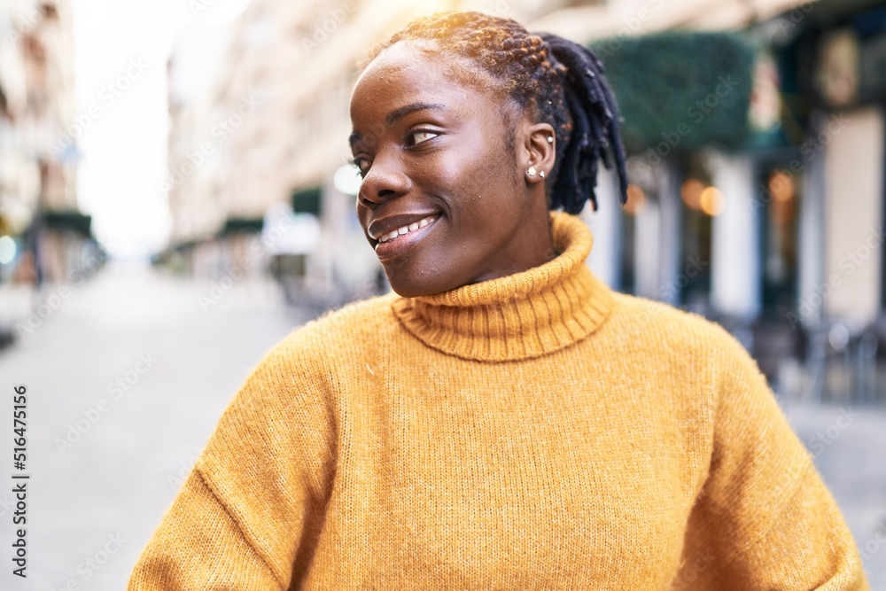 African american woman smiling confident standing at street