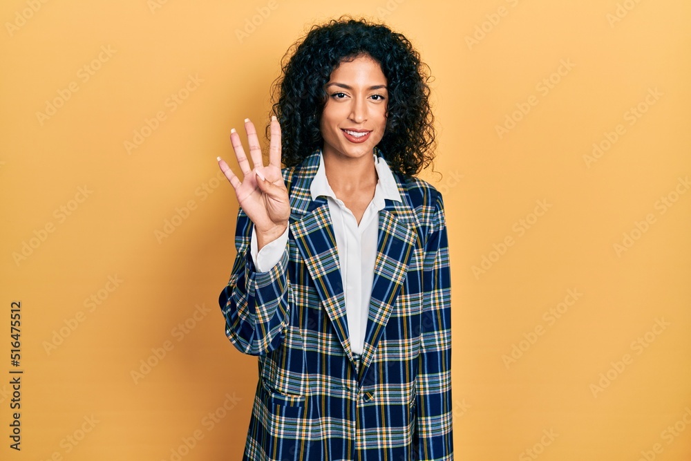 Young latin girl wearing business clothes showing and pointing up with fingers number four while smiling confident and happy. Young latin girl wearing business clothes showing and pointing up with fingers number four while smiling confident and happy.