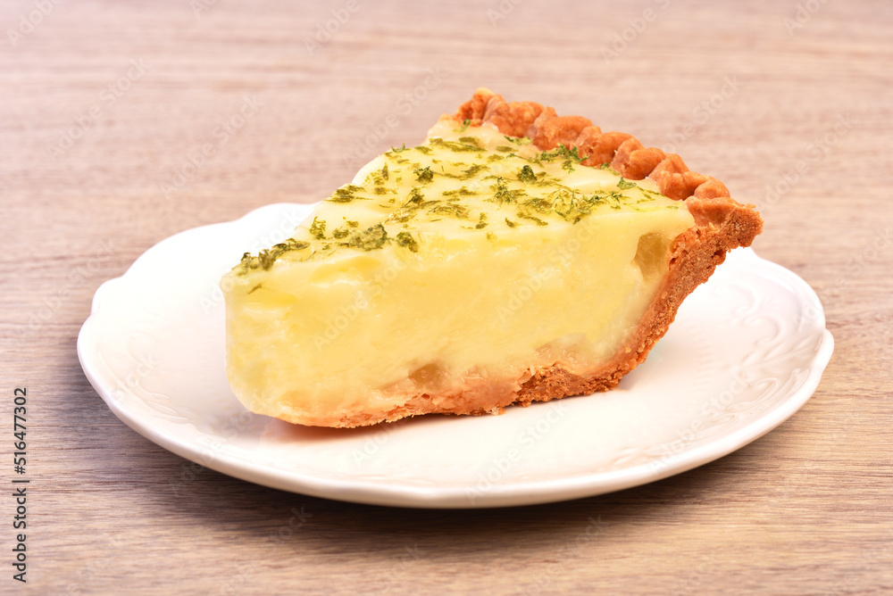 A slice of delicious lemon aloe vera pie served on table A slice of delicious lemon aloe vera pie served on table