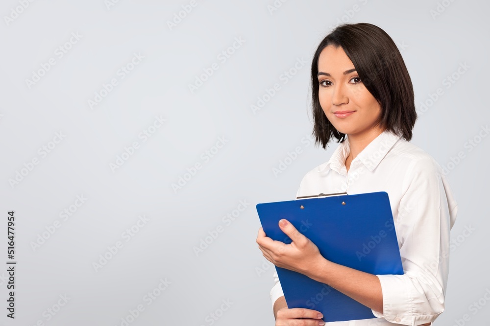 Portrait of cheerful charming girl hold tablet posing on the background Portrait of cheerful charming girl hold tablet posing on the background