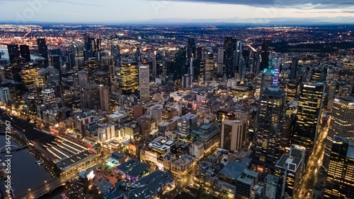 Aerial drone view of Melbourne City  Victoria  Australia looking in the direction of Port Phillip above Yarra River in the early morning at dawn 