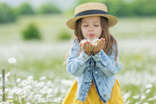 happy girl in the field with flowers. High quality photo