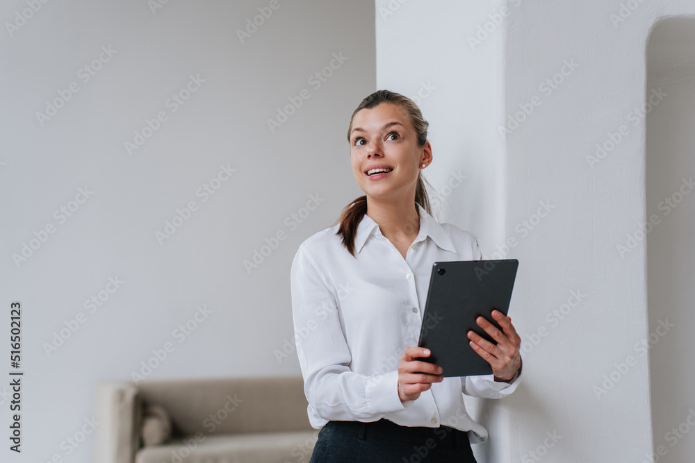 I have idea! Beautiful excited brunette female manager holding tablet leaning on wall rolling up eyes, she found solution. Pretty caucasian businesswoman thinking at office. Mockup business, finance. I have idea! Beautiful excited brunette female manager holding tablet leaning on wall rolling up eyes, she found solution. Pretty caucasian businesswoman thinking at office. Mockup business, finance.