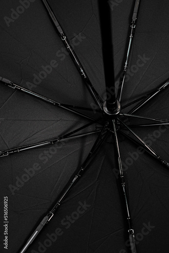 Black protective umbrella against rain and sun