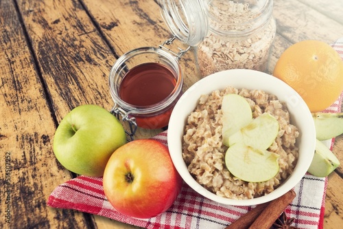 Oatmeal bowl. Oat porridge withfruits and milk for healthy breakfast or lunch. Healthy food, diet.