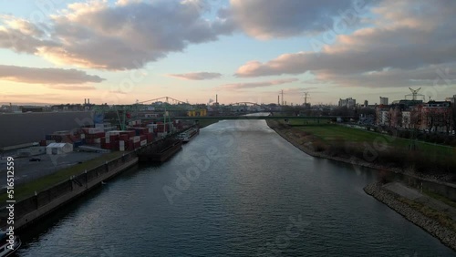 Wallpaper Mural Tilt up aerial view of the Neckar river with the bridges of the city of Mannheim, Baden-Württemberg, Germany. Afterglow in the background Torontodigital.ca