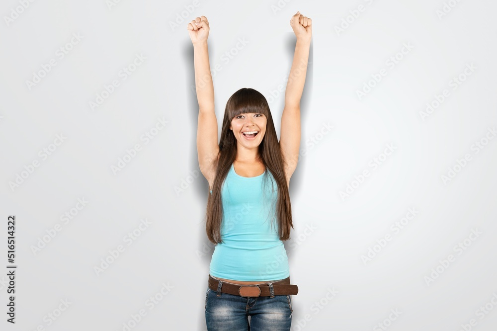 Excited young woman, cheering, triumphing, achieve goal and celebrating concept. Excited young woman, cheering, triumphing, achieve goal and celebrating concept.
