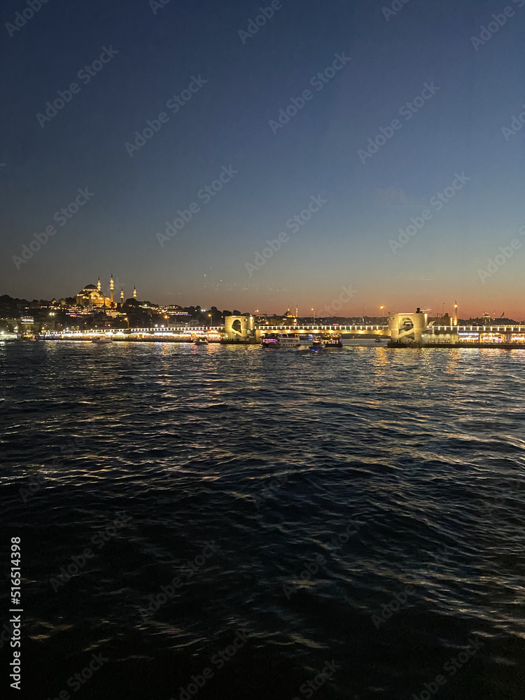 Istanbul City Ferry with sunset over Bosphorus. Golden sky over Bosphorus, Istanbul