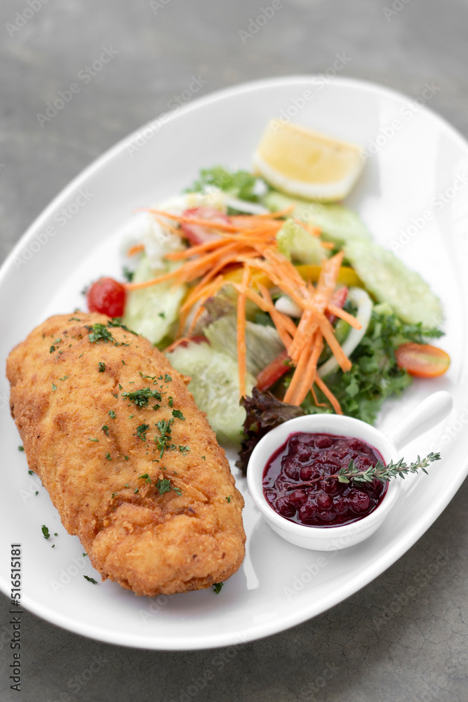 chicken cordon bleu with salad and cranberry sauce chicken cordon bleu with salad and cranberry sauce