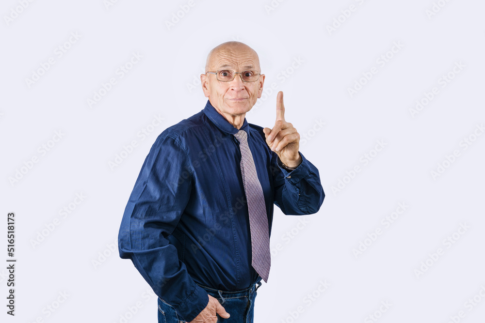 Mature manager in glasses and necktie stands with thumb up isolated on white background. Business idea and creative concept. Mature manager in glasses and necktie stands with thumb up isolated on white background. Business idea and creative concept.