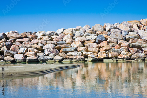 Rock wall protection from the waves - concept image photo