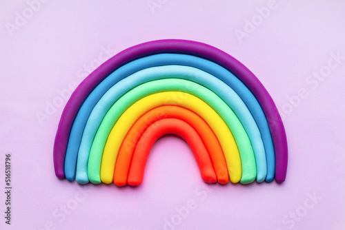 Colorful rainbow of plasticine on pink background. Made from plasticine. Isolate photo