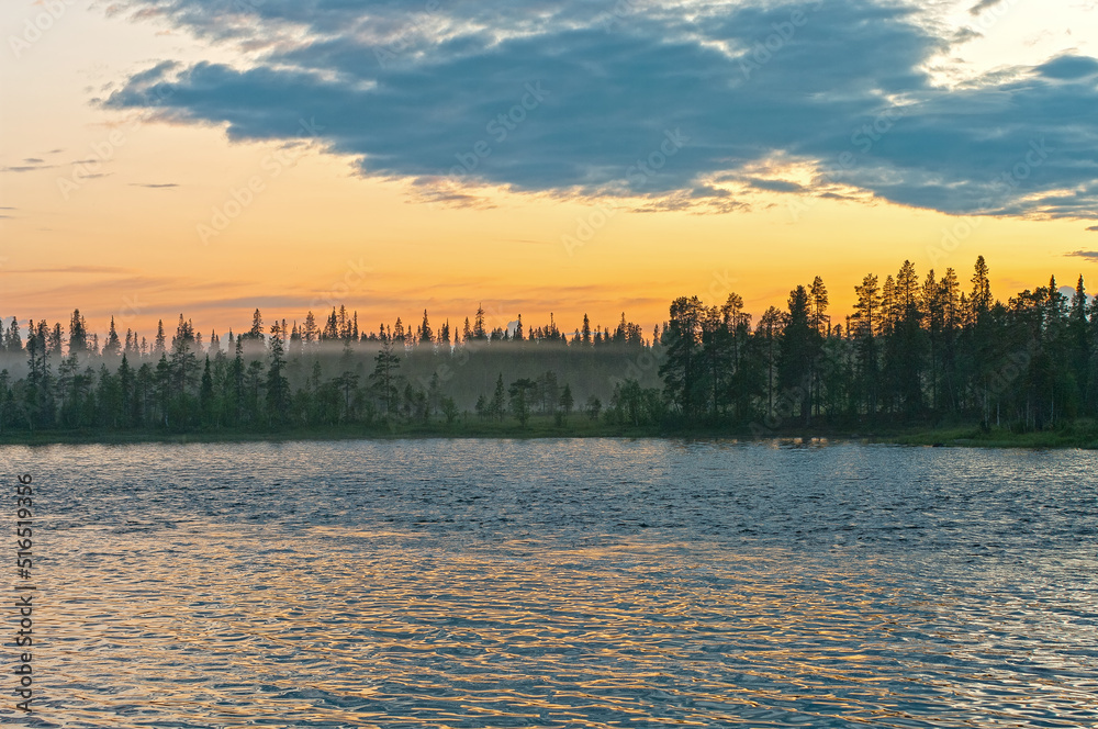 Obraz premium Summer evening on the bank of the polar river.