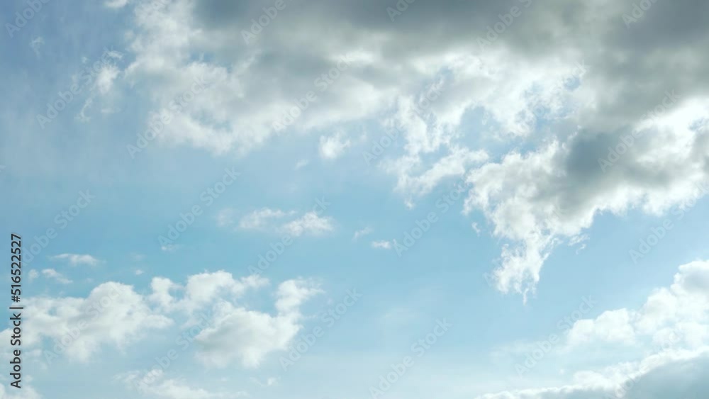 Beautiful Light Blue Sunny Sky with White and Gray Soaring Transforming Clouds, Time Lapse. Blue Skyscraper in Sun Rays with Slight Clouds on a Sunny Clear Day, Atmosphere, Beauty, Relax, Air, Height. Beautiful Light Blue Sunny Sky with White and Gray Soaring Transforming Clouds, Time Lapse. Blue Skyscraper in Sun Rays with Slight Clouds on a Sunny Clear Day, Atmosphere, Beauty, Relax, Air, Height.