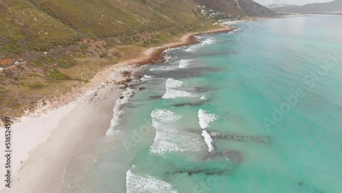 Beautiful Calm Drone Flight over Waves, Beach and Cliffs in South Africa, Cape Town photo