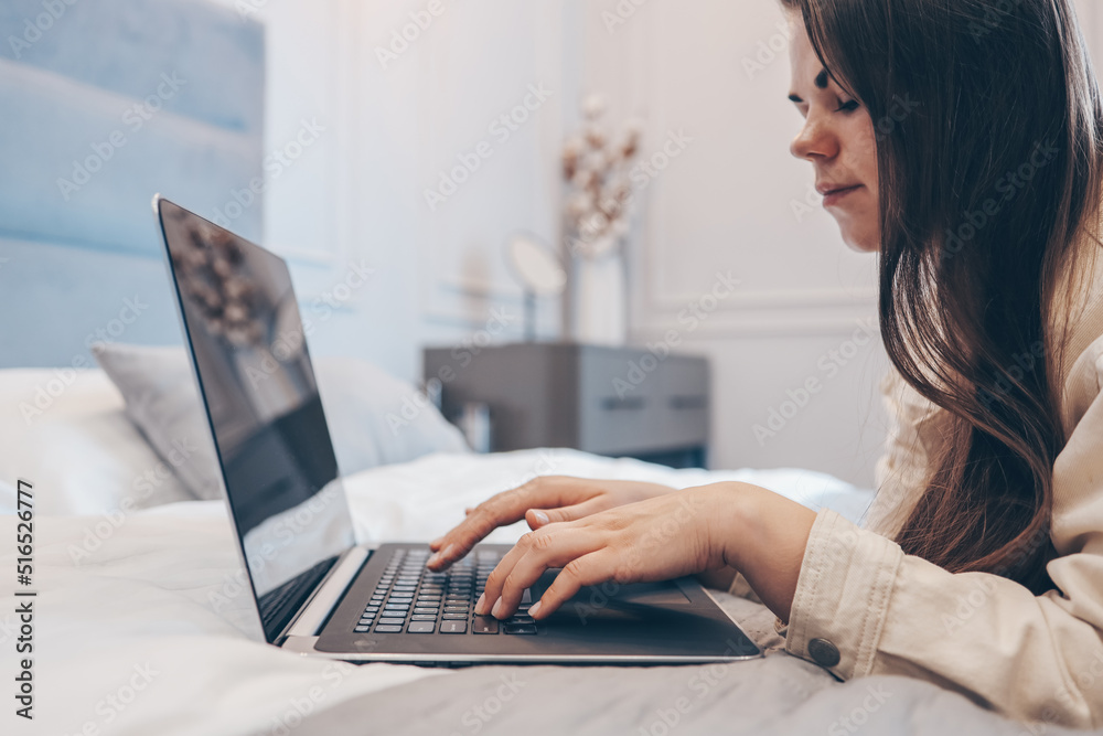 Fototapeta premium Work from home concept with woman working on laptop computer