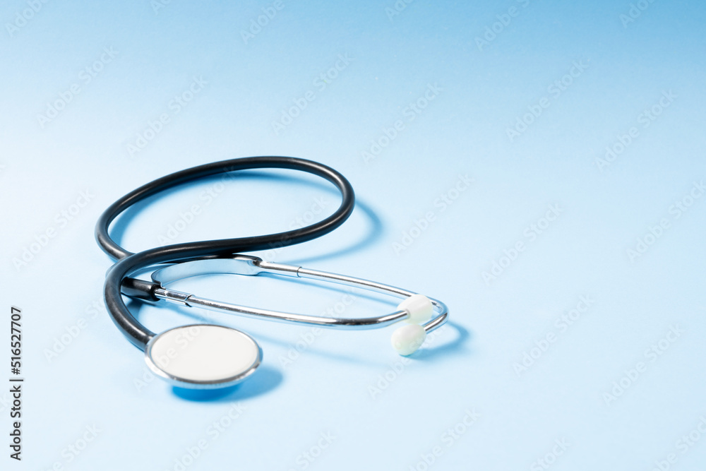 Fototapeta premium Close up view of stethoscope on the blue background.