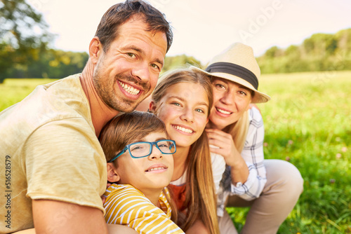 Family with two children in nature in summer