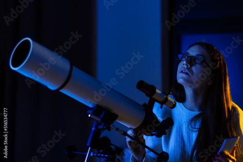 Obraz na plátne Astronomer woman looks through telescope at night sky, space, cosmos, universe, Milky way