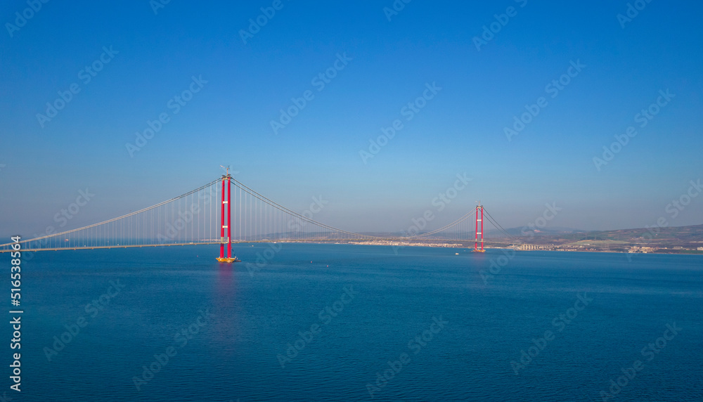 1915 Canakkale Bridge aerial view in Canakkale, Turkey. World's longest suspension bridge opened in Turkey. Turkish: 1915 Canakkale Koprusu. Bridge connect the Lapseki to the Gelibolu. 1915 Canakkale Bridge aerial view in Canakkale, Turkey. World's longest suspension bridge opened in Turkey. Turkish: 1915 Canakkale Koprusu. Bridge connect the Lapseki to the Gelibolu.