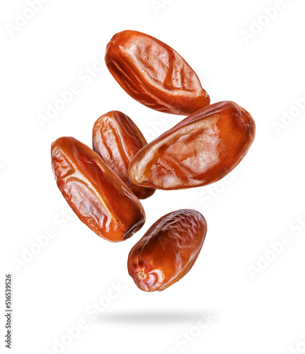 Delicious dried dates in the air closeup on a white background photo