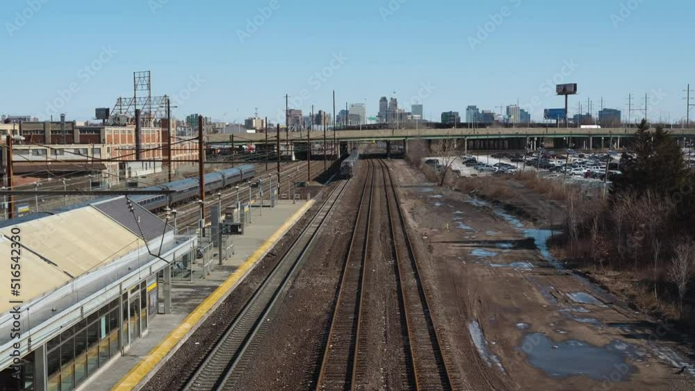 NJ Transit and AirTrain moving along train tracks NJ Transit and AirTrain moving along train tracks