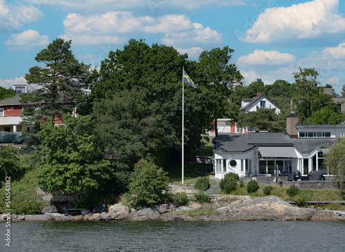  Summertime view of houses on islands in the archipelago outside of Stockholm, the capital of Sweden, one of the Nordic countries along the Baltic Sea in Scandinavia, Europe. 