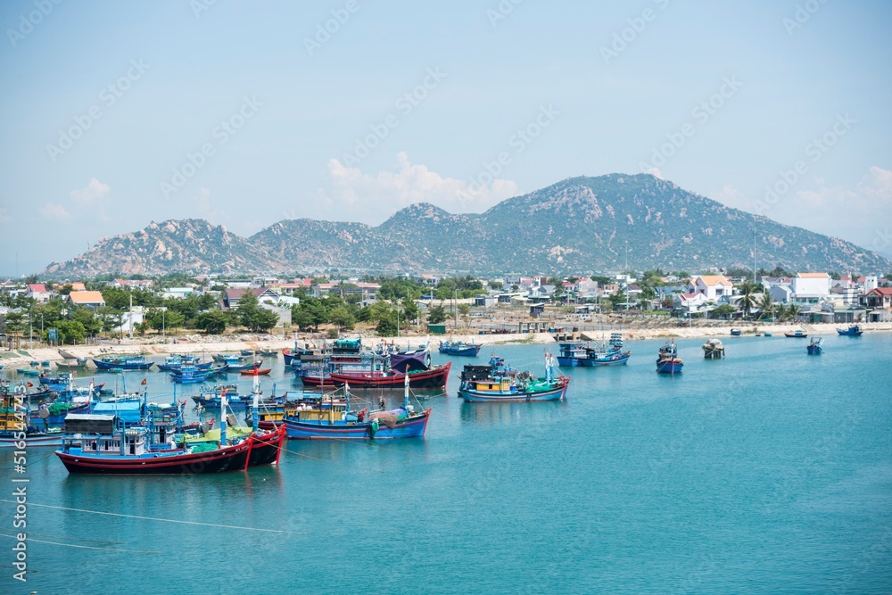 Landscape photo: fishing boats along the coast of Vinh Hy Bay. Time: June 20, 2022. Location: Phan Rang City.  