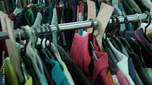 Showcase with a second-hand hanger. Humanitarian aid warehouse.