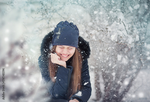 Wallpaper Mural The girl laughs because snow falls on her. The girl is warmly dressed. Worth a Winter day. Torontodigital.ca
