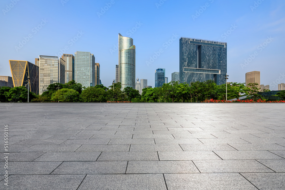 Empty square floor and city skyline with modern commercial buildings in Hangzhou, China.
