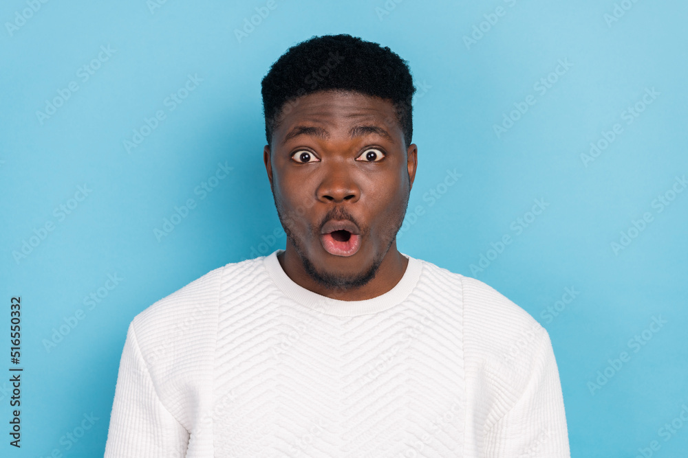 Photo of cheerful good mood overjoyed impressed man see huge bargains black friday isolated on blue color background