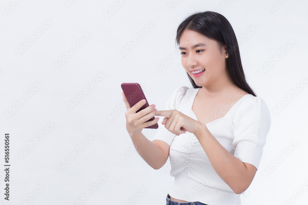Portrait of beautiful asian women Use the mobile phone happily on a white background Portrait of beautiful asian women Use the mobile phone happily on a white background