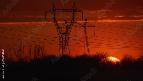 Sunset timelapse behind power lines