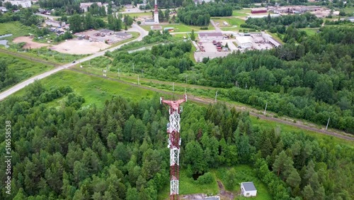 High tower with antennas to provide 3g, 4g, 5g communication and the Internet. top drone aerial view hd footage