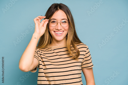 Caucasian woman wearing eyeglasses and looking happy