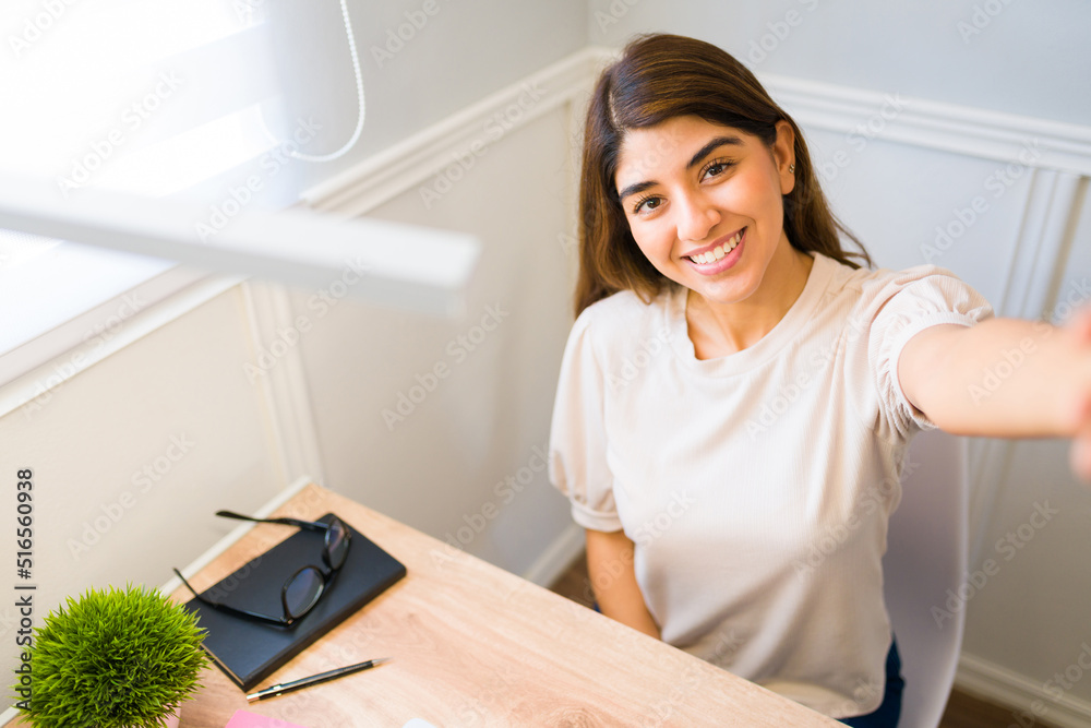 Smiling woman feeling happy while working from home Smiling woman feeling happy while working from home