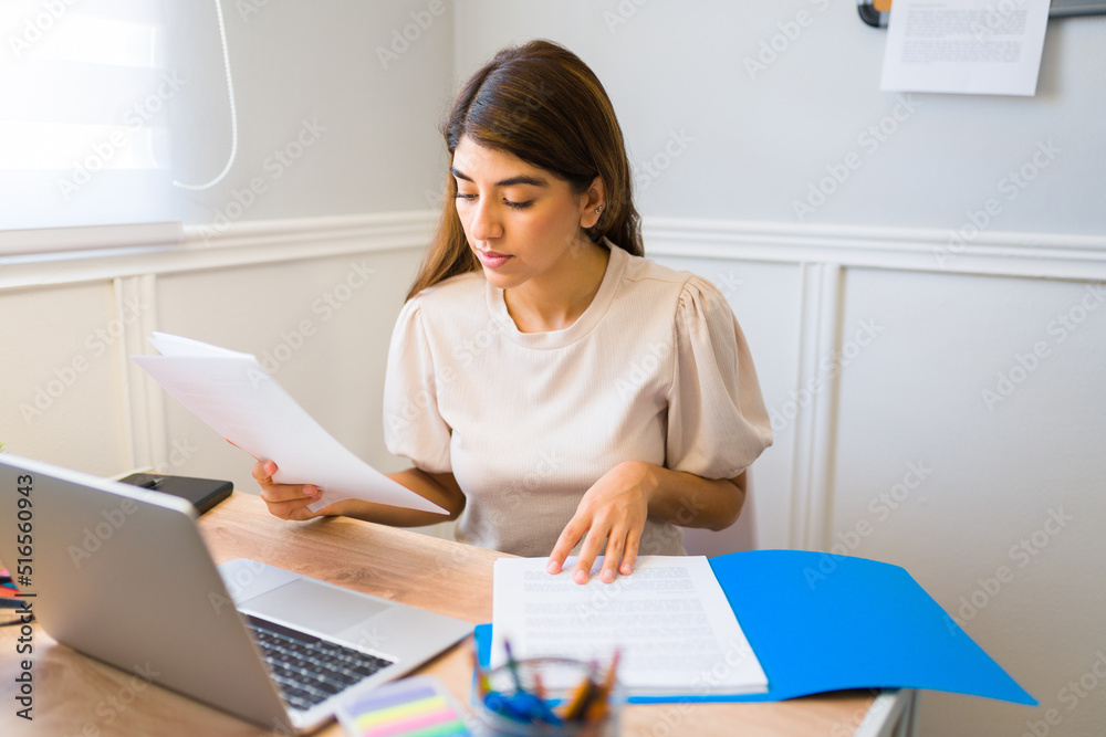 Young woman doing work reports for his remote work Young woman doing work reports for his remote work