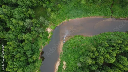 Aerial drone view of beautiful deep forest river at sunset. Natural background