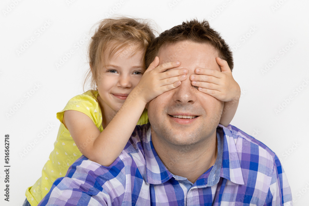 Family portrait. Guess who it is, the daughter covered her father's eyes with her hands. Family portrait. Guess who it is, the daughter covered her father's eyes with her hands.